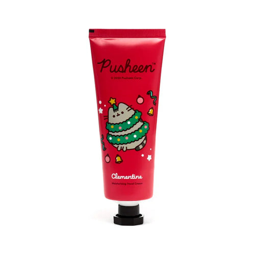 Front view of a red moisturising hand cream tube, adorned with a Christmas Pusheen the Cat illustration, depicting a grey cat dressed as a festive Christmas tree with a yellow star, surrounded by baubles, bells, and stars.