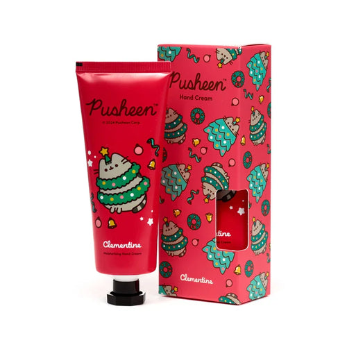 Front view of a red Christmas Pusheen the Cat hand cream tube and its matching gift box, both decorated with festive cat Christmas tree designs, bells, and 'Clementine' labelling.