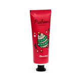 Front view of a red hand cream tube, decorated with a Christmas Pusheen the Cat illustration wearing a green tree costume and festive baubles. The tube displays 'Clementine Moisturising Hand Cream' in white text.