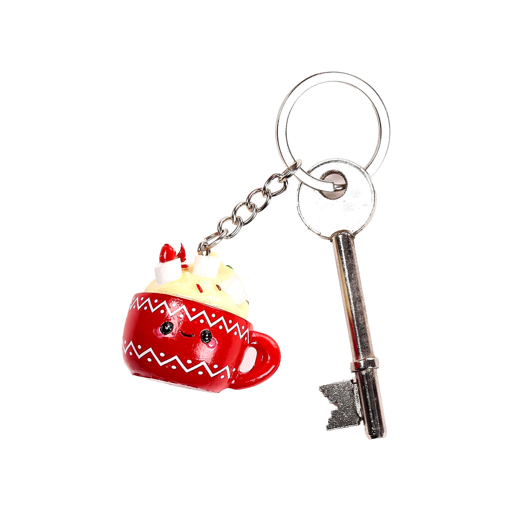 Front view of a novelty keyring featuring a red hot chocolate mug charm with a cute face, white whipped cream, and marshmallows, attached to a silver key ring and a metal key.