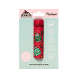 Front view of a Christmas Pusheen the Cat paper stick lip balm. The red paper tube features Pusheen in festive Christmas tree designs. It is presented in mint green packaging, indicating clementine flavour, zero waste, vegan, and plastic-free attributes.