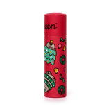 Front view of a red cylindrical paper stick lip balm featuring Christmas-themed illustrations, including Pusheen the Cat as a festive tree and wrapped in green garland, surrounded by small wreaths and bells.