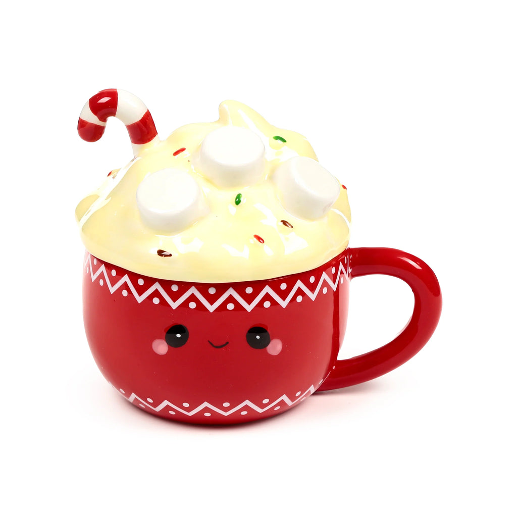 Angled front view of a red ceramic lidded mug, featuring a cute face design. The yellow lid is shaped like whipped cream, topped with white marshmallows, colourful sprinkles, and a red and white candy cane. The mug body has a white zigzag pattern.