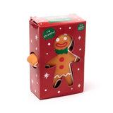 Front view of a Christmas gingerbread man stretchy fidget toy in a red retail box with a gingerbread man cutout and white snowflakes.