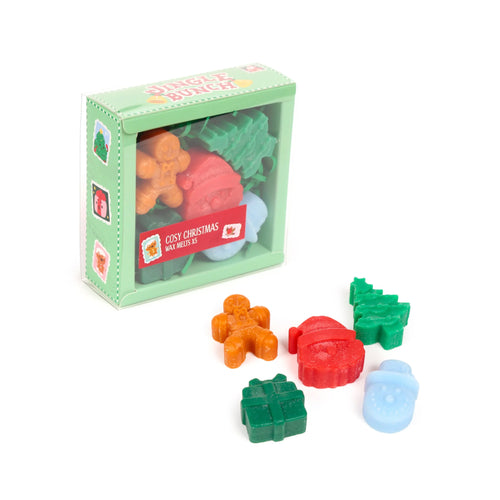 Angled view of a Cosy Christmas Jingle Bunch wax melt set of five, featuring an orange gingerbread man, red Santa hat, green Christmas tree, green gift, and light blue snowman shapes, presented in a green postal-themed box and individually on a white background.