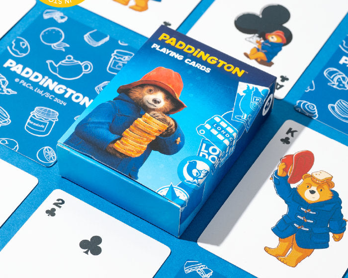 Paddington Bear-themed playing cards with packaging and cards displayed.