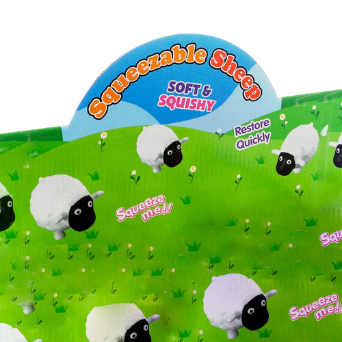 Angled close-up of 'Squeezable Sheep' toy packaging, showing white sheep illustrations on a green field backdrop. Visible text includes Soft & Squishy and Squeeze me!!.