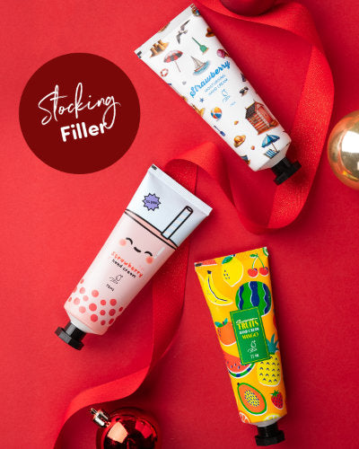 Three hand cream tubes with colourful packaging on a red background, with a 'Stocking Filler' callout.