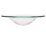 Side view of a transparent glass oil burner dish, featuring a wide flat rim with a subtle greenish tint, and a shallow bowl-shaped centre.