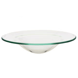 Angled view of a clear glass oil burner dish, featuring a wide, flat rim and a curved bowl.
