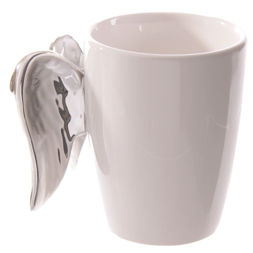 Angled view of a white ceramic mug featuring a silver angel wings handle.