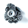 Overhead view of a dark grey gargoyle backflow incense burner, featuring a textured stone-effect finish and a central metal incense holder.