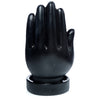 Front view of a black mantric hand backflow incense burner, showing an open palm, upright fingers, and a circular base.