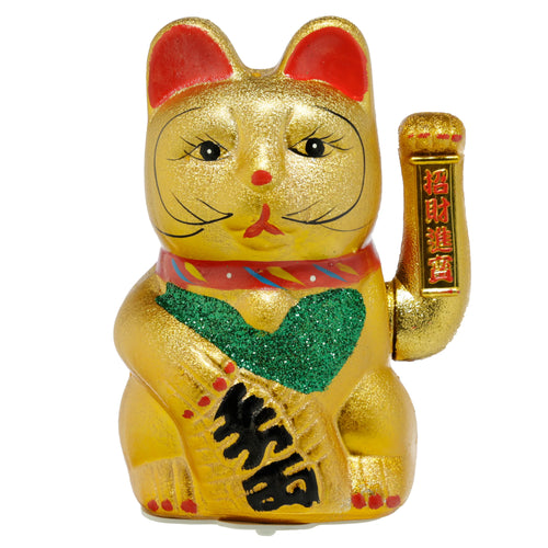 Front view of a large, gold, glitter-finished Maneki Neko lucky waving cat. It features red inner ears, a red collar with colourful detailing, and a green glittery bib. Its raised paw holds a gold banner with red oriental characters, and its other paw holds an item with black oriental script.
