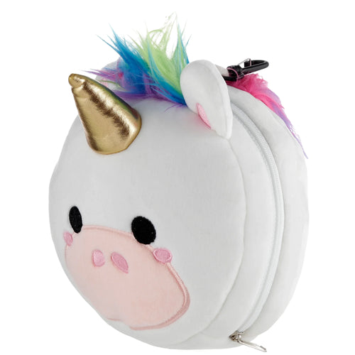 Angled view of a white plush unicorn travel pillow with a gold horn, pink ears, black embroidered eyes, and a colourful blue, green, and pink mane, showing the side zipper and attached carabiner clip.