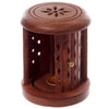 Angled view of a dark sheesham wood carved barrel incense cone burner, featuring a door with a brass knob and diamond-shaped cut-outs on its sides. The top is decorated with a carved star pattern, and a brass-coloured cup is visible inside.
