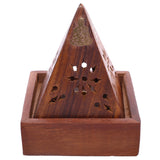 Sheesham wood pyramid incense cone burner box, showing a brass-coloured Buddha inlay and decorative star-shaped cut-outs on one of its pyramid faces, with a square base.