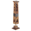 Angled view of a two-part mango wood incense tower ashcatcher and base. The dark wood tower features silver-coloured elephant inlays, carved star and triangular ventilation holes, and decorative metal details on top. The square base includes a gold-coloured holder for incense sticks and cones.