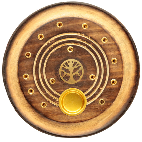 Overhead view of a round mango wood incense holder and ashcatcher. It features a brass-coloured Tree of Life motif, a central cone burner, and multiple brass incense stick holders, all within a two-tone wooden design with a burnt edge.