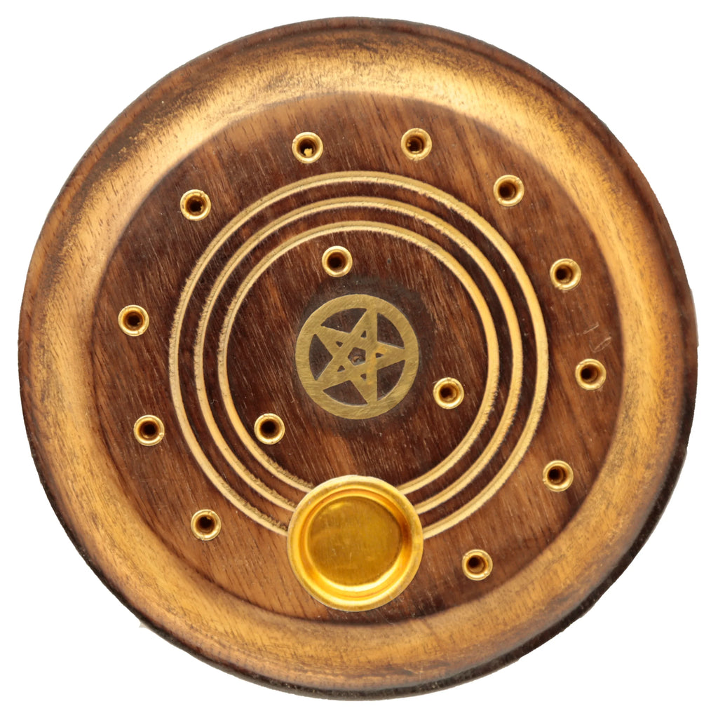 Overhead view of a round mango wood incense holder and ashcatcher, featuring an inlaid brass pentagram design, multiple brass-coloured holes for incense sticks, and a well for incense cones.