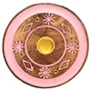 Overhead view of a round mango wood ashcatcher incense holder. It features a pink coloured outer ring and intricate pink floral and diamond patterns on the natural wood centre, with a central brass cone burner and four brass incense stick holes.
