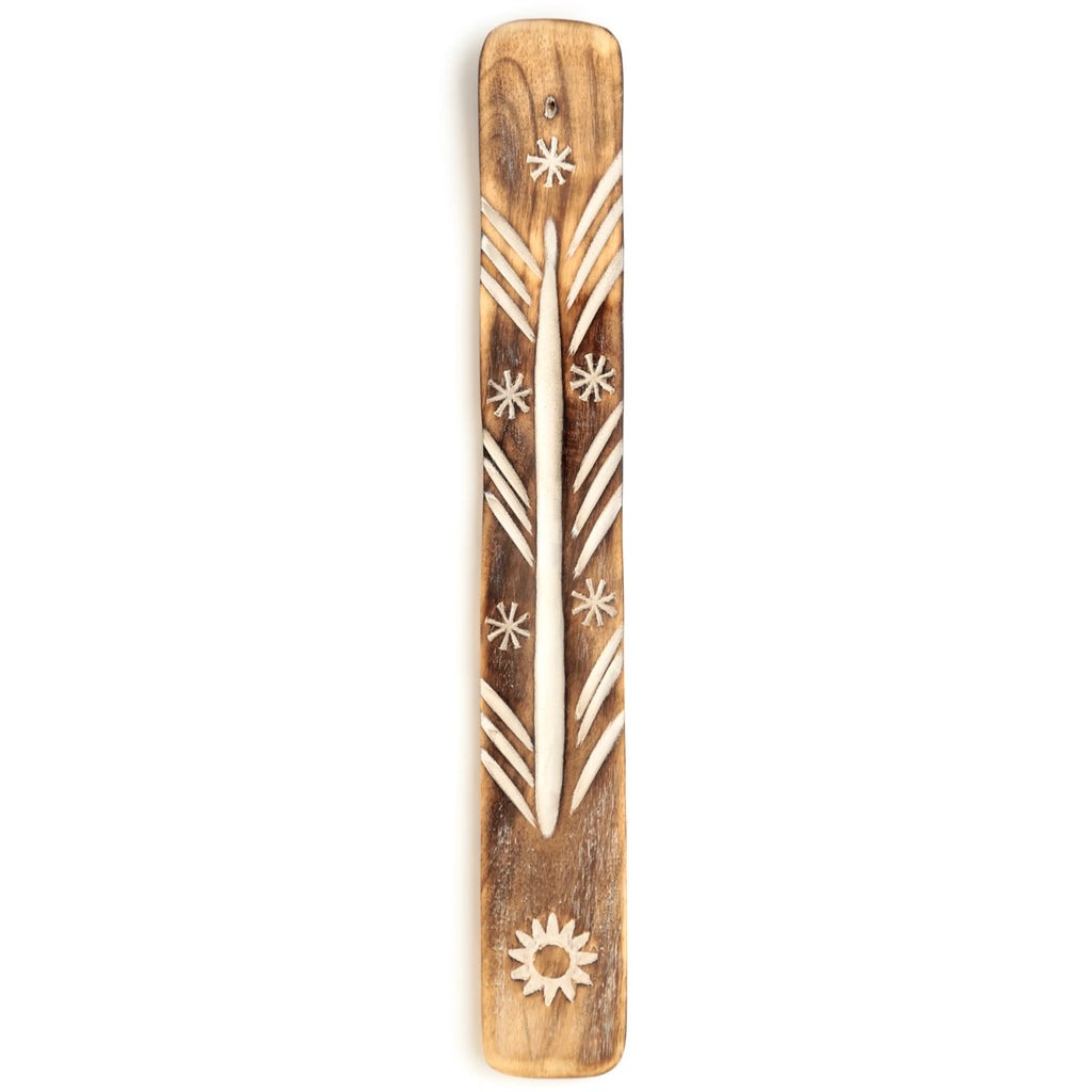 Natural mango wood incense ashcatcher with carved sun and star patterns, a central ash-catching groove, and an incense stick holder, viewed from above.