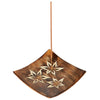 Angled view of a square mango wood incense stick holder and ashcatcher, featuring light carved floral designs and an incense stick standing upright.