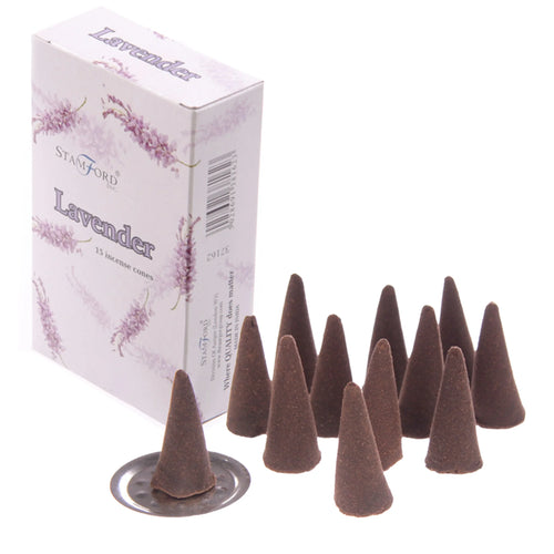 Angled view of a light-coloured product box with purple lavender illustrations and 'Lavender' text, shown alongside approximately fifteen dark brown lavender incense cones, with one cone on a silver-coloured metal holder.