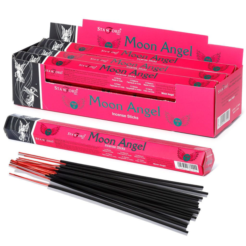 Angled view of a display carton holding six hot pink 'Moon Angel' incense stick boxes, alongside one individual pink box and a pile of black incense sticks with red tips, set against a white background.