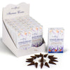 Angled view of a retail display box filled with Stamford Stress Relief incense cone boxes, featuring lavender and orange blossom illustrations. A single white box stands separately, alongside a circular arrangement of dark brown incense cones and a small metal holder, all on a plain white background.