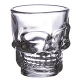 Angled view of a clear glass skull shot glass, showing moulded eye sockets, nose cavity, and teeth.