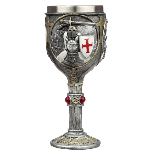 Front view of a decorative silver-coloured goblet featuring an embossed Crusader knight motif with a red cross shield and armoured horse's head. The stem has red jewels and gold-coloured detailing, and the base is ornate.