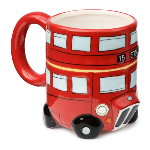 Angled view of a red ceramic London Routemaster bus shaped mug, showing light blue windows, black wheels, a yellow stripe, and '15 STRA' route number detail. A red handle is visible on the left.