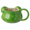 Angled view of a green ceramic mug shaped like a tree frog's head, featuring a mottled finish, visible handle, and white interior.