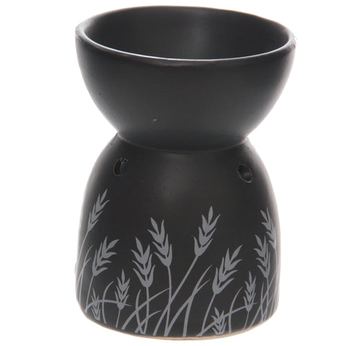 Angled view of a black ceramic oil and wax burner, featuring a light grey grass design on its lower section.