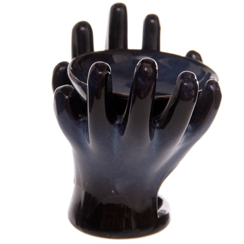 Angled view of an open hands ceramic oil burner, featuring a deep blue-black glossy glaze with lighter blue variations.