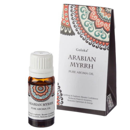 Angled view of an amber glass bottle of Arabian Myrrh pure aroma oil with a white ridged cap and a colourful patterned label, next to its white packaging box featuring matching decorative patterns and text.