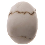 Angled top view of a light-coloured skull ornament, detailing its rounded cranium with dark, irregular suture lines.