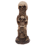 Front view of a light brown Hear No Speak No See No Evil skull totem figurine, featuring three stacked skulls with an aged, bone-like finish.