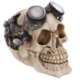 Three-quarter view of a bone-coloured steampunk skull ornament with metallic goggles, frosted lenses, and intricate cranium cogs.