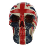 Front view of a red, white, and blue Union Flag skull head decoration, featuring dark eye sockets and a distressed paint finish.