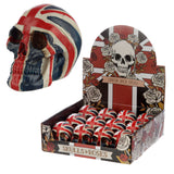 Angled view of a Union Flag Skull Head Decoration ornament, featuring red, white, and blue Union Flag colours. The figurine is displayed next to a retail box filled with more identical skull ornaments, which is decorated with skull and rose artwork.