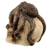 Angled view of a bronze octopus skull ornament, featuring a textured, dark bronze octopus wrapped around a natural-coloured skull.