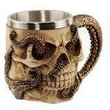 Angled view of a decorative cream skull tankard with detailed bronze octopus tentacles wrapped around its surface and forming the handle, showcasing the metallic inner lining.