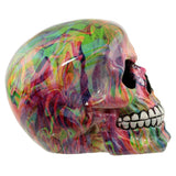 Right side view of a glossy rainbow marble effect skull ornament.