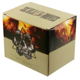 Angled view of a brown cardboard packaging box for a skull ornament, featuring vibrant orange and red fiery patterns, hexagonal skull designs, and 'SKULL & BONES' and 'SKULL ORNAMENT' text on the front.