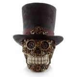 Front view of a Steampunk style skull ornament, featuring intricate metallic gears and cogs, wearing a dark top hat with a matching gear-detailed band.