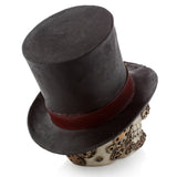 Rear angled view of a Steampunk style skull ornament, featuring a black top hat with a dark red band and the skull's side adorned with brass-coloured gears.