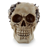Front view of a steampunk style skull ornament, featuring cogs and gears and an aged bone colour.