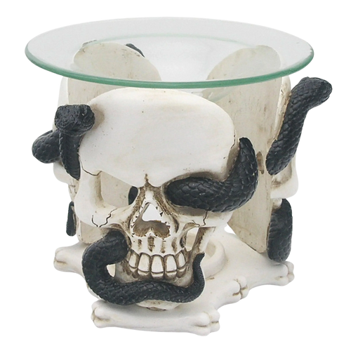 Front view of a cream-coloured skull and black serpent resin oil and wax burner with a clear glass dish.